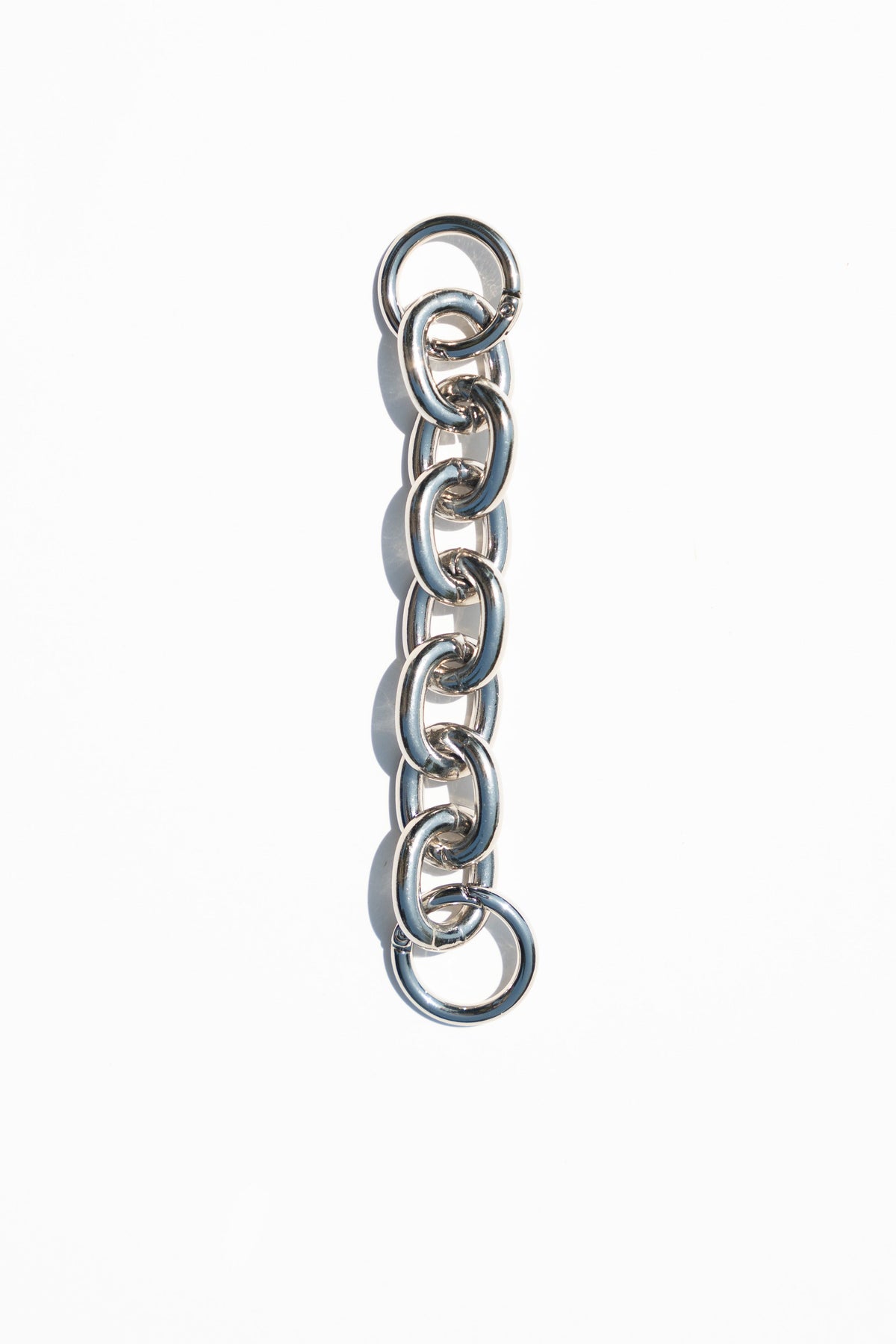 6-inch polished aluminum extender chain with removable spring rings.