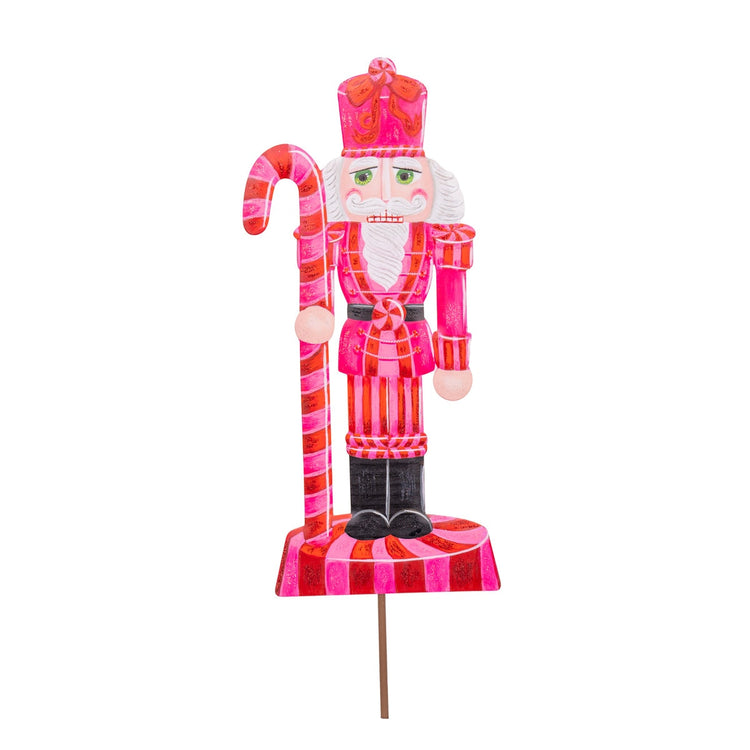 Pinkmas medium nutcracker with a pink finish, designed to stake, hang, or display on an easel.