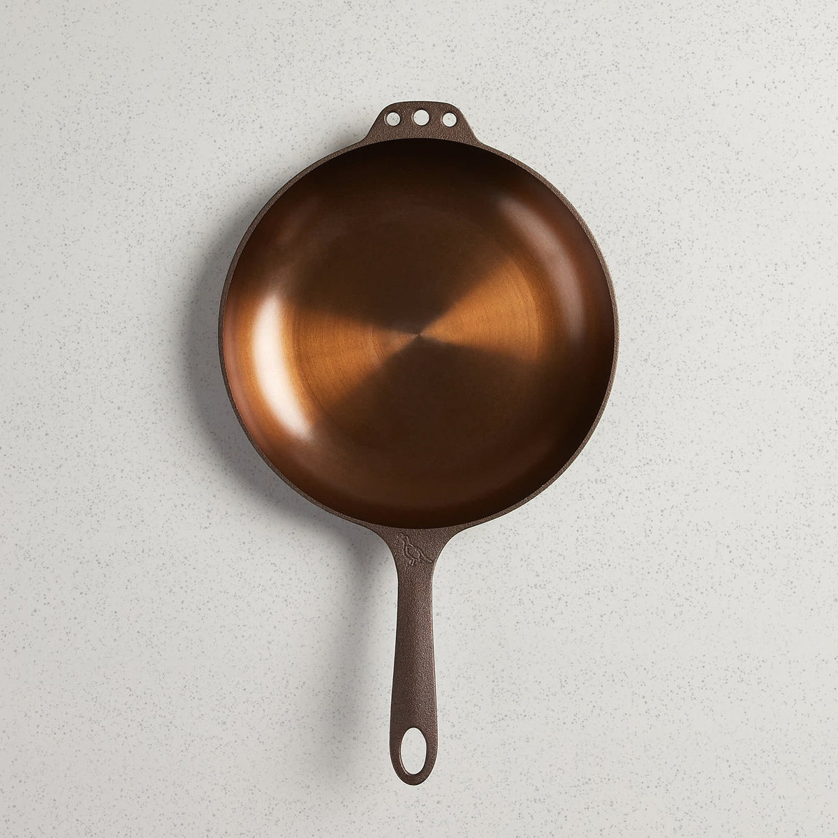 No. 10 Chef Skillet with satin-smooth polished finish, extended handle, and hanging holes on both sides.