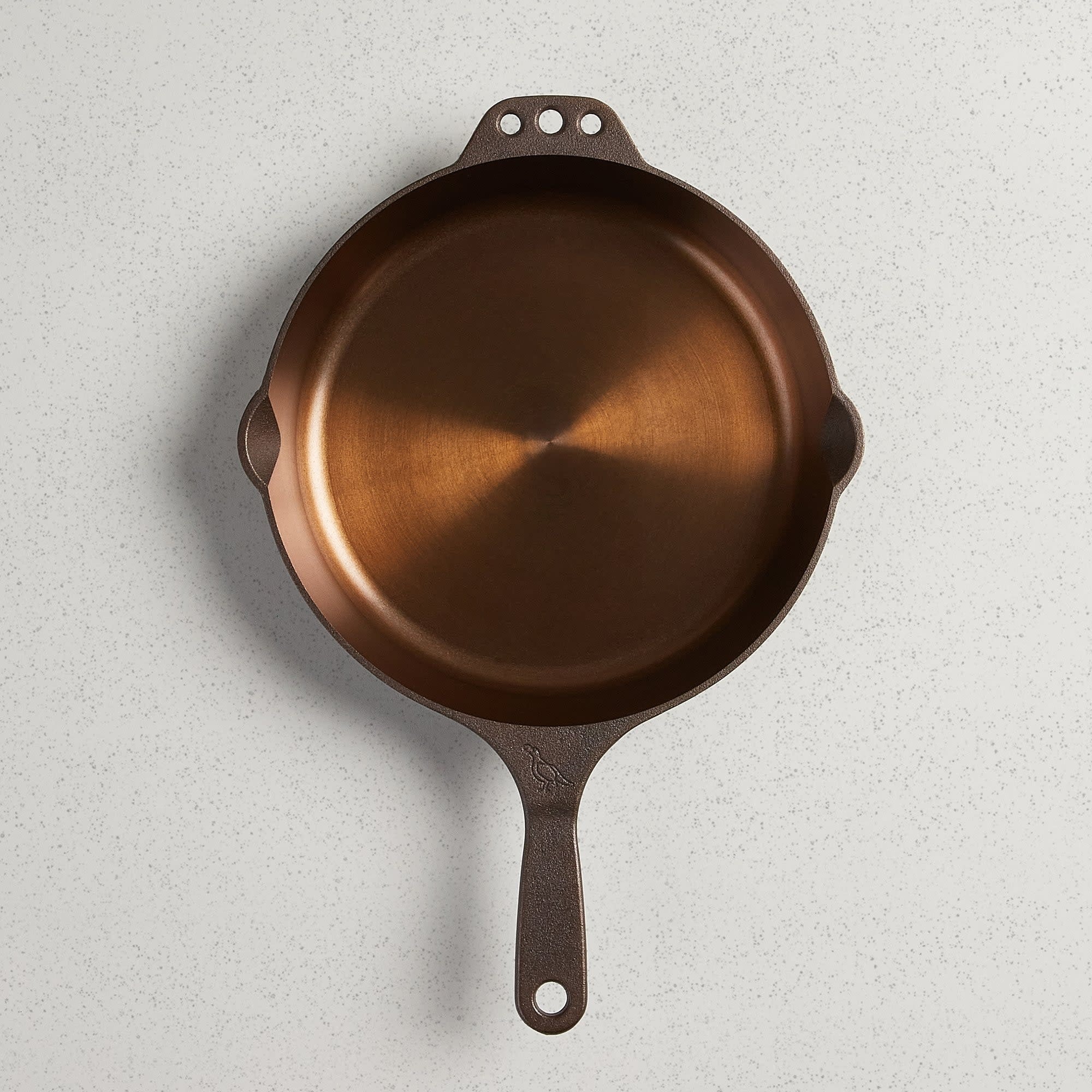 No. 10 Traditional cast iron skillet with polished interior, pour spouts, helper handle, and hanging holes.