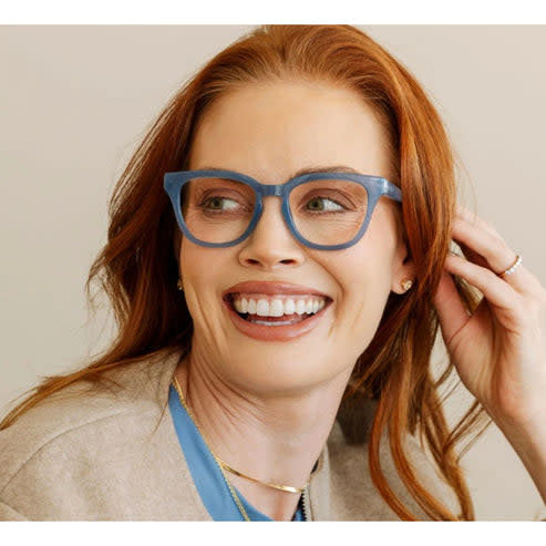Nola eyeglasses with denim-colored acetate frames featuring a classic rectangular silhouette and clear lenses.