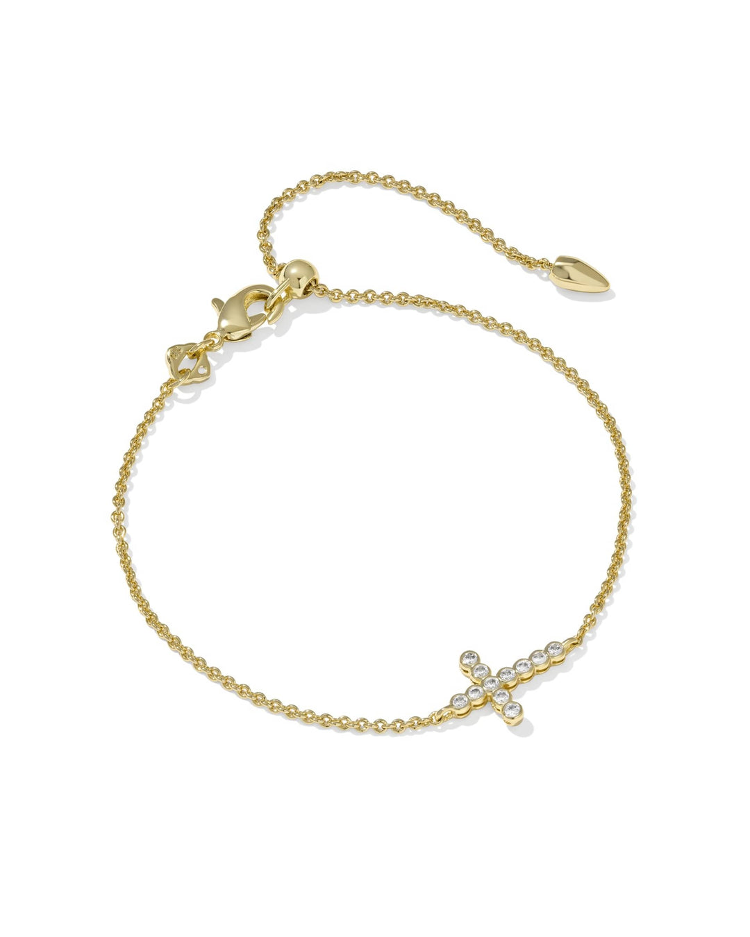 Gold chain bracelet with a crystal-encrusted cross charm and an adjustable slider bead closure.