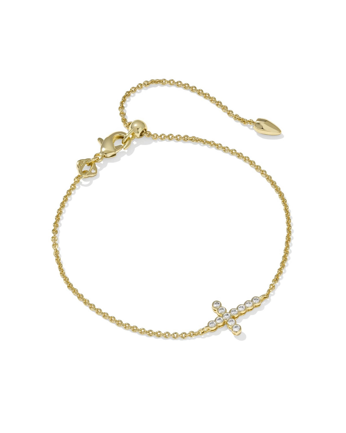 Gold chain bracelet with a crystal-encrusted cross charm and an adjustable slider bead closure.