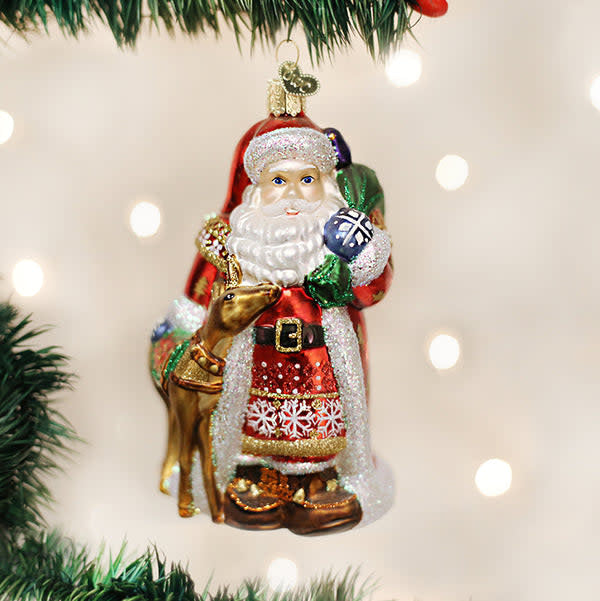 Nordic Santa ornament featuring a white matte finish with red accents on the hat and boots.