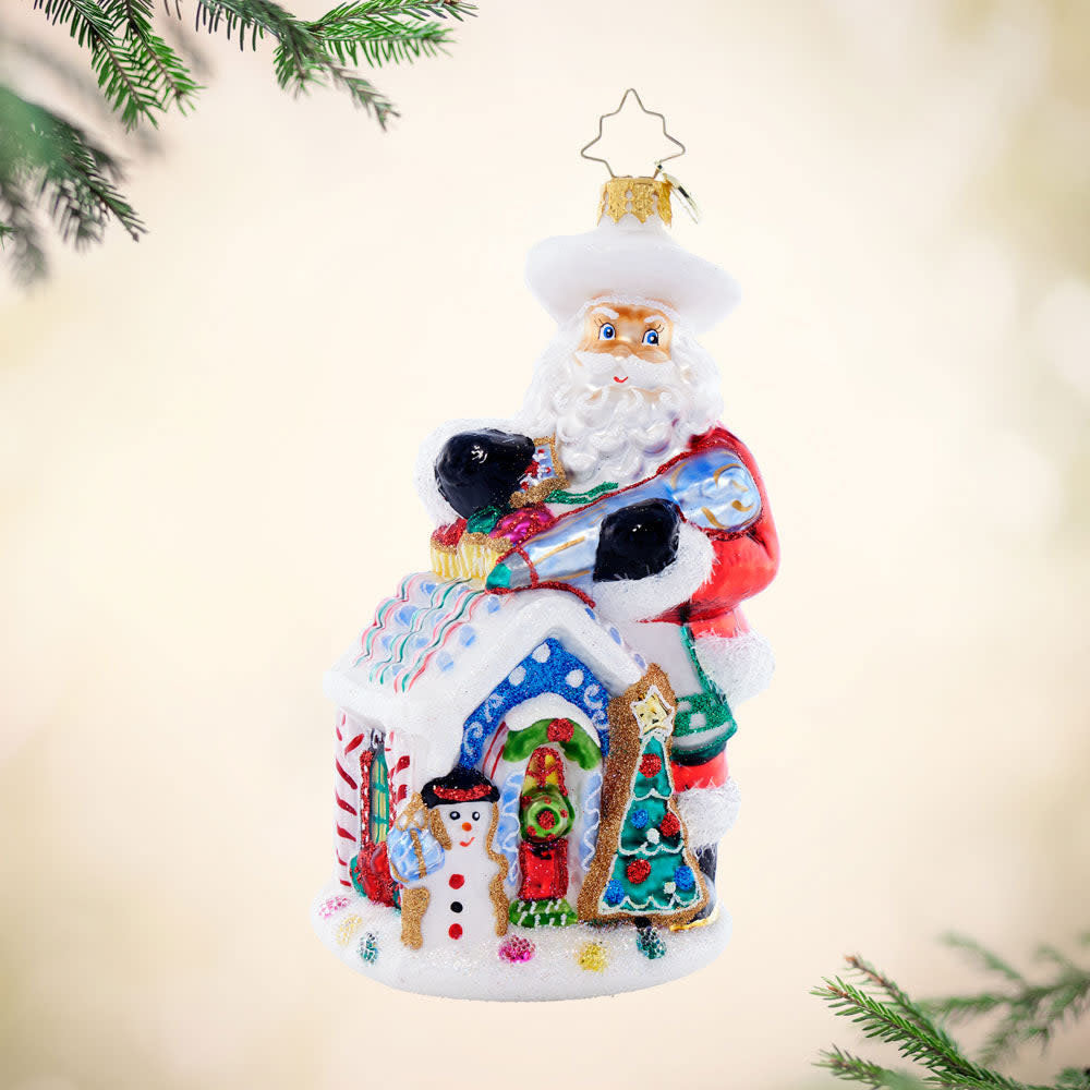North Pole Bake Off ceramic mug featuring Santa Claus in a chef's hat baking cookies on snowy ground.