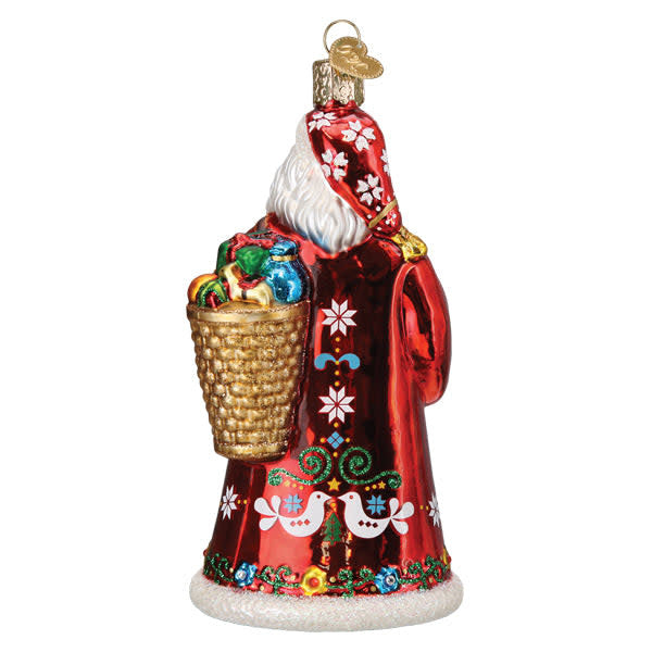 Norwegian Santa ornament featuring a red figure with white beard holding gifts against black background