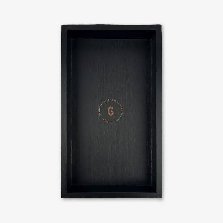 Black bamboo tray designed to hold Geometry not paper towels.