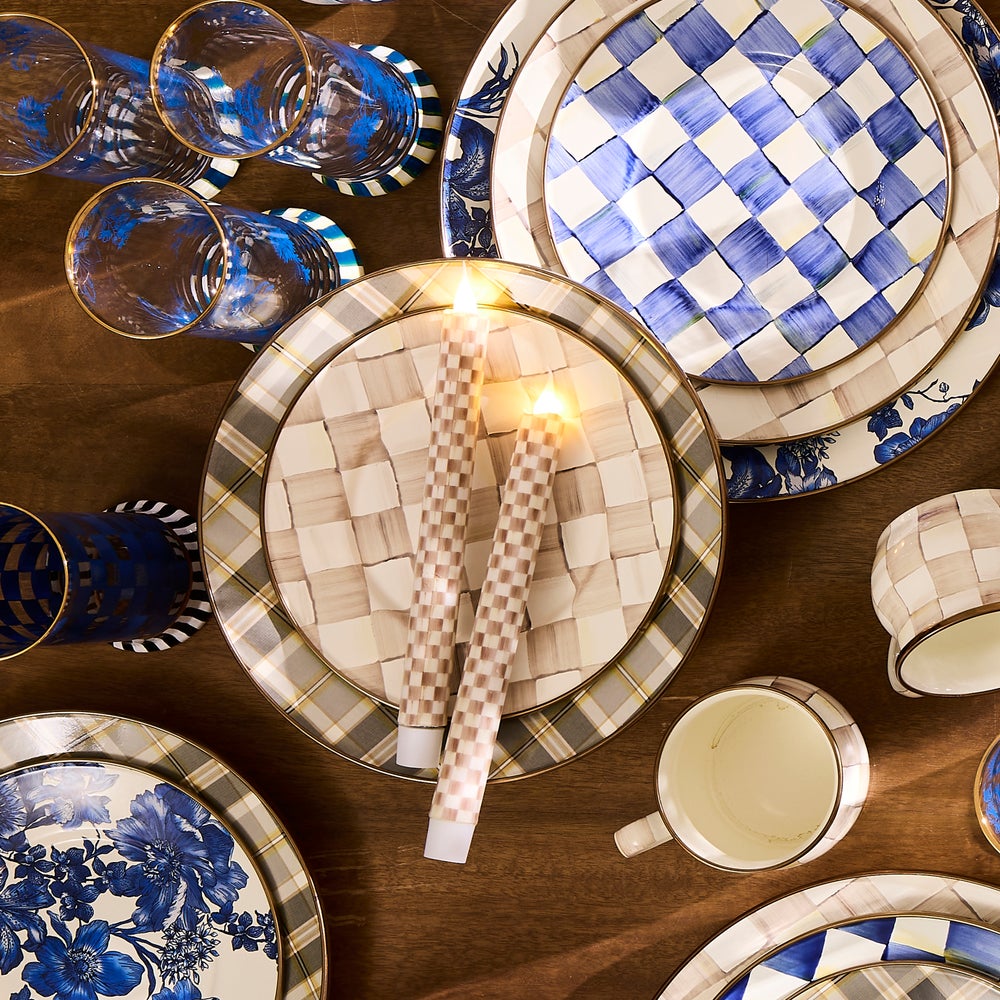 Two mocha-colored flameless dinner candles with a checkered wax exterior pattern.