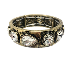 Antique gold stretch bracelet featuring round and teardrop gems with a two-inch diameter.