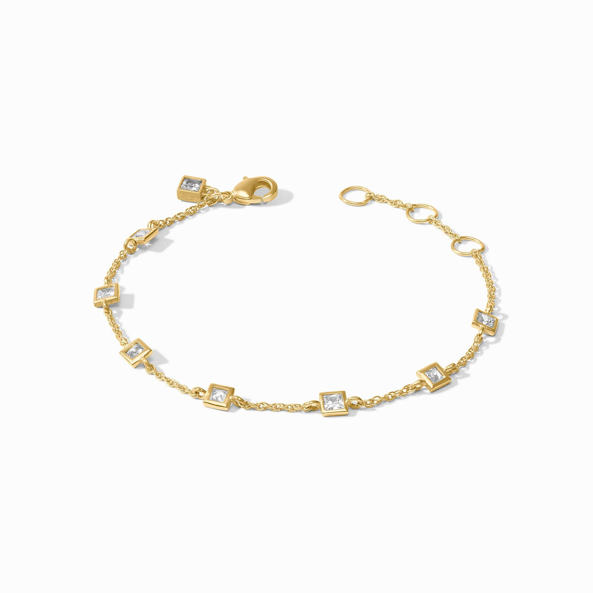 Delicate adjustable bracelet with cubic zirconia stones on a gold plate finish.
