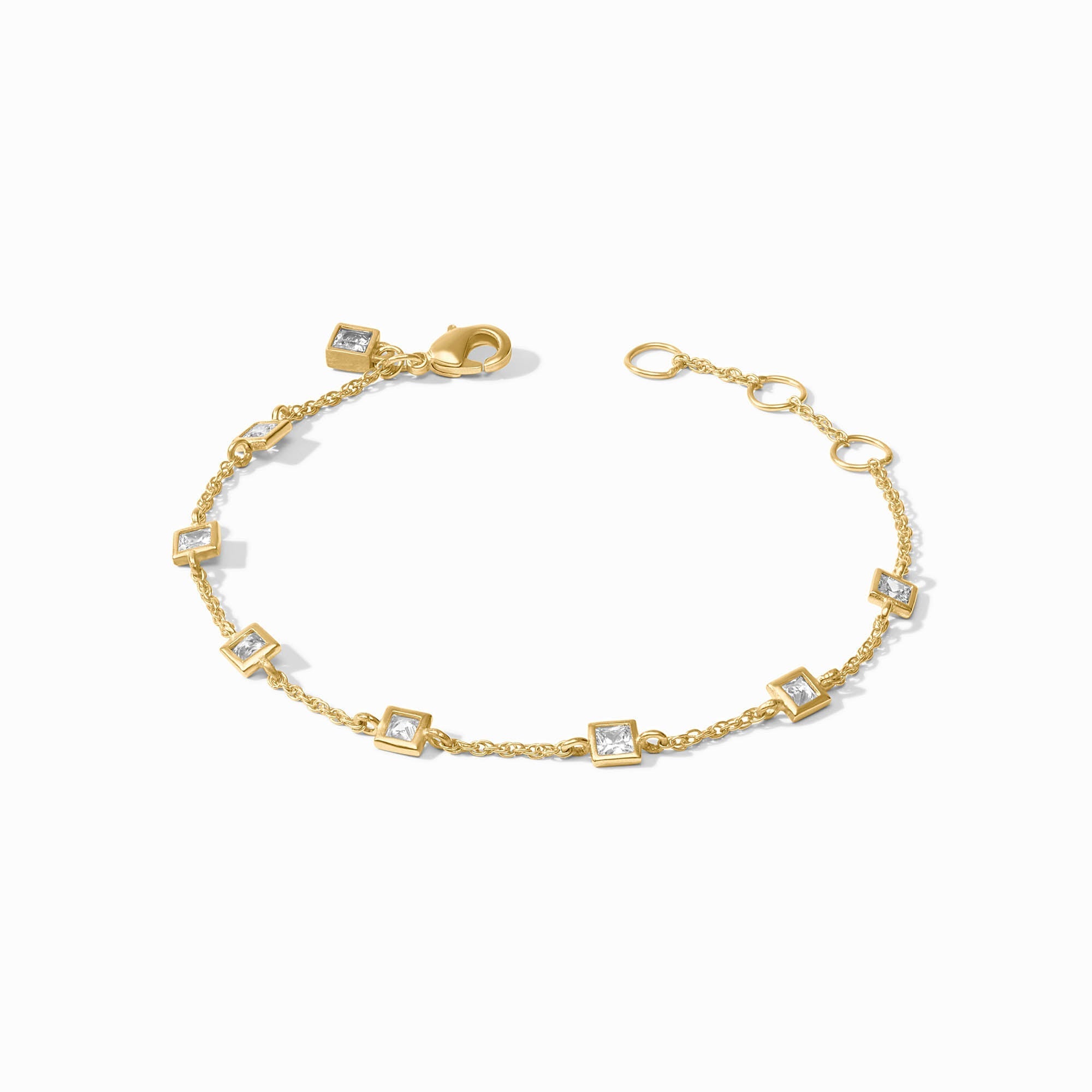 Delicate adjustable bracelet with cubic zirconia stones on a gold plate finish.