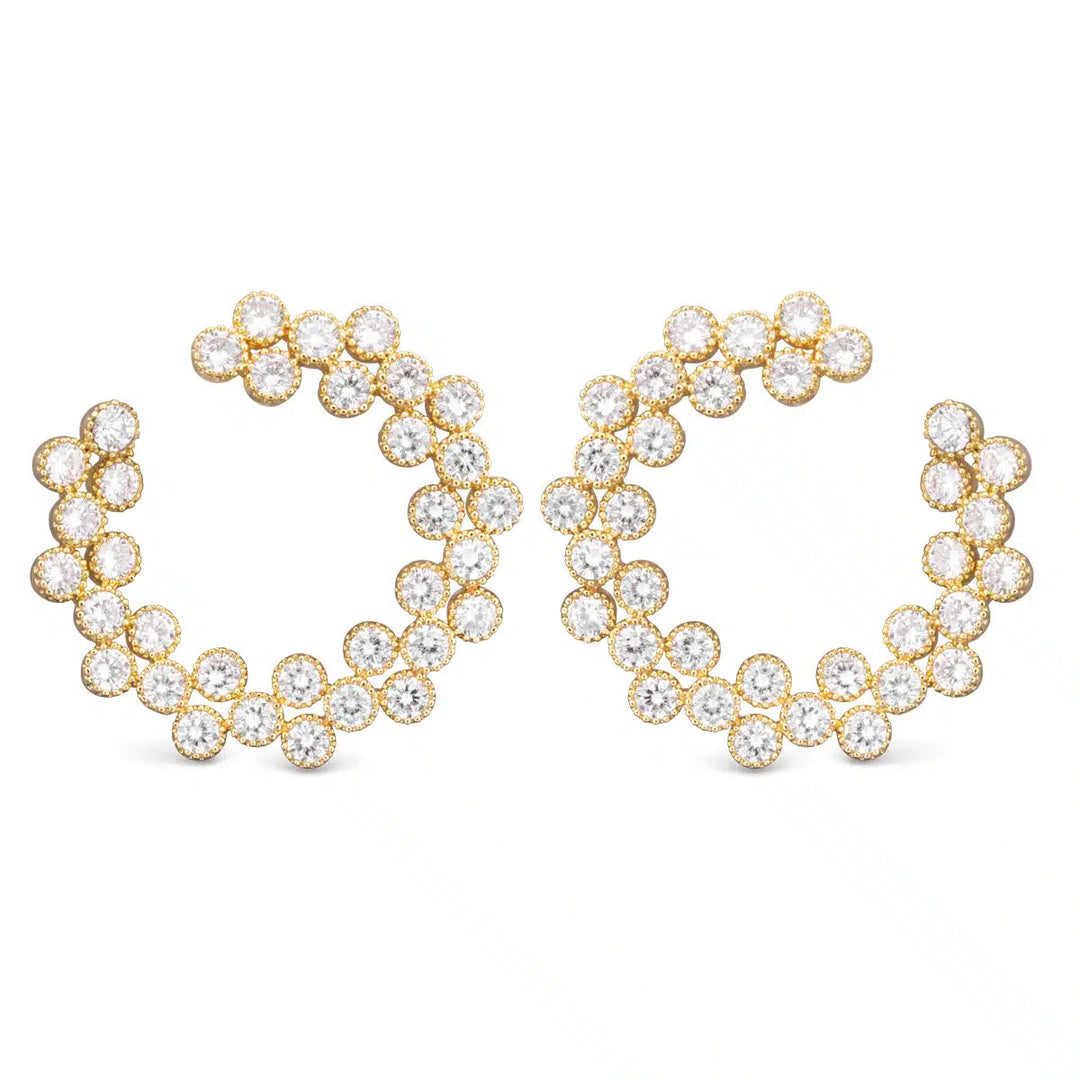 Gold open circle earrings featuring a double row of round-cut cubic zirconia stones.