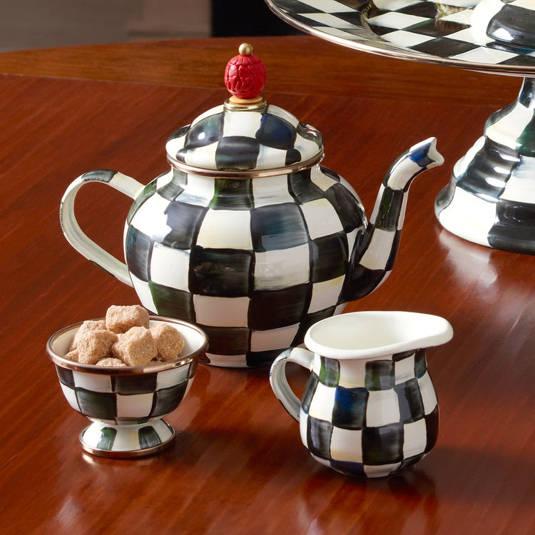 Hand-painted creamer with courtly check enamelware pattern on heavy-gauge steel.