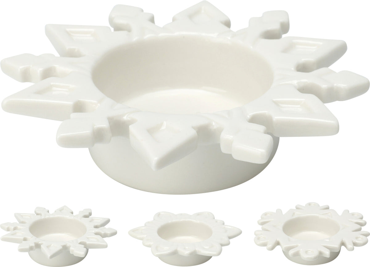 A white ceramic tealight holder shaped like a snowflake, shown from multiple angles.