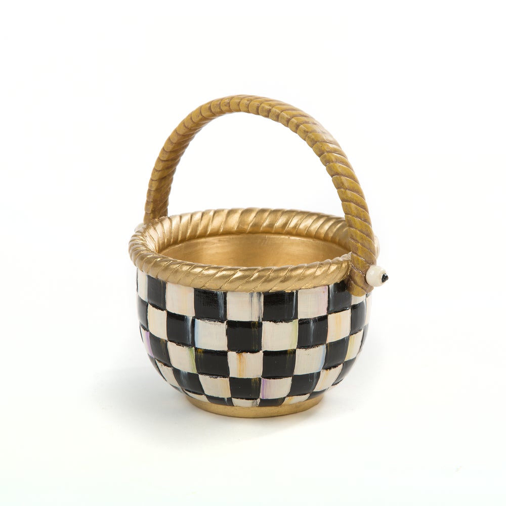 Small resin basket with a black and white checkered pattern and gold rope-style handle and rim.