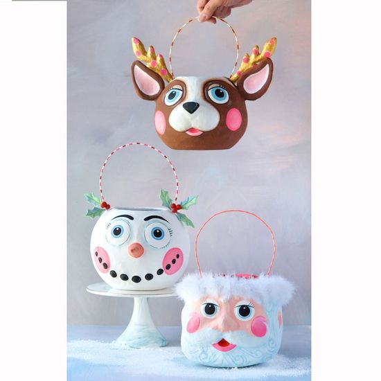 Paper mache Christmas bucket with festive holiday decoration.