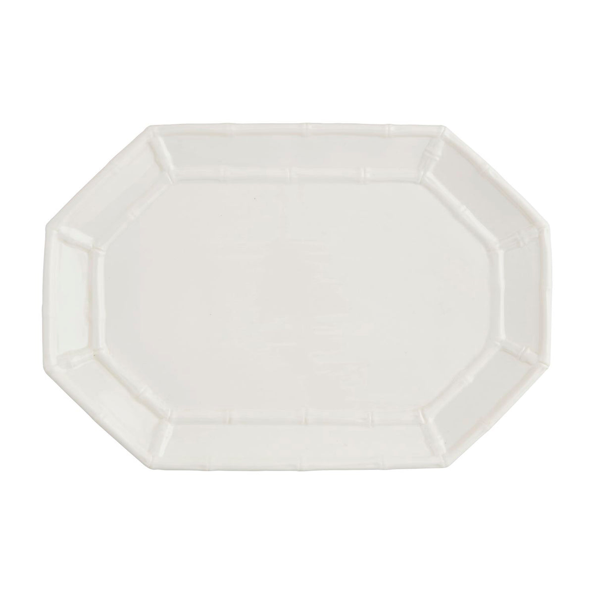 Octagonal white stoneware platter with a raised bamboo-style border design.