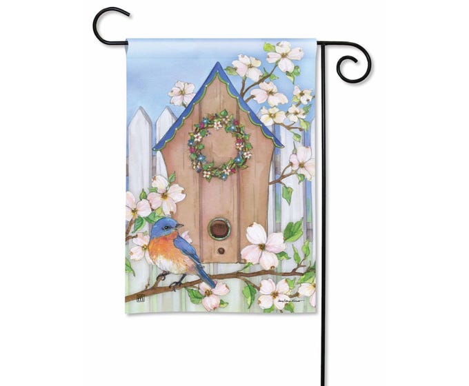 Green garden flag with white floral vine pattern on a rectangular pole.
