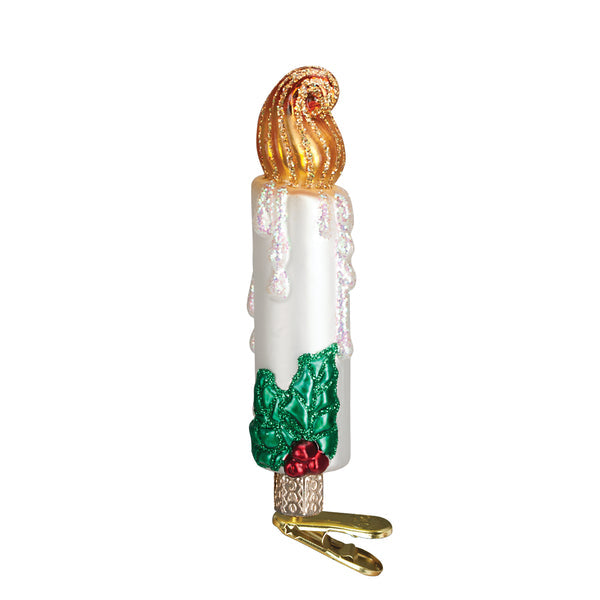 Clip-on candle ornament with a white wax body, black metal clip frame, and clear glass chimney.