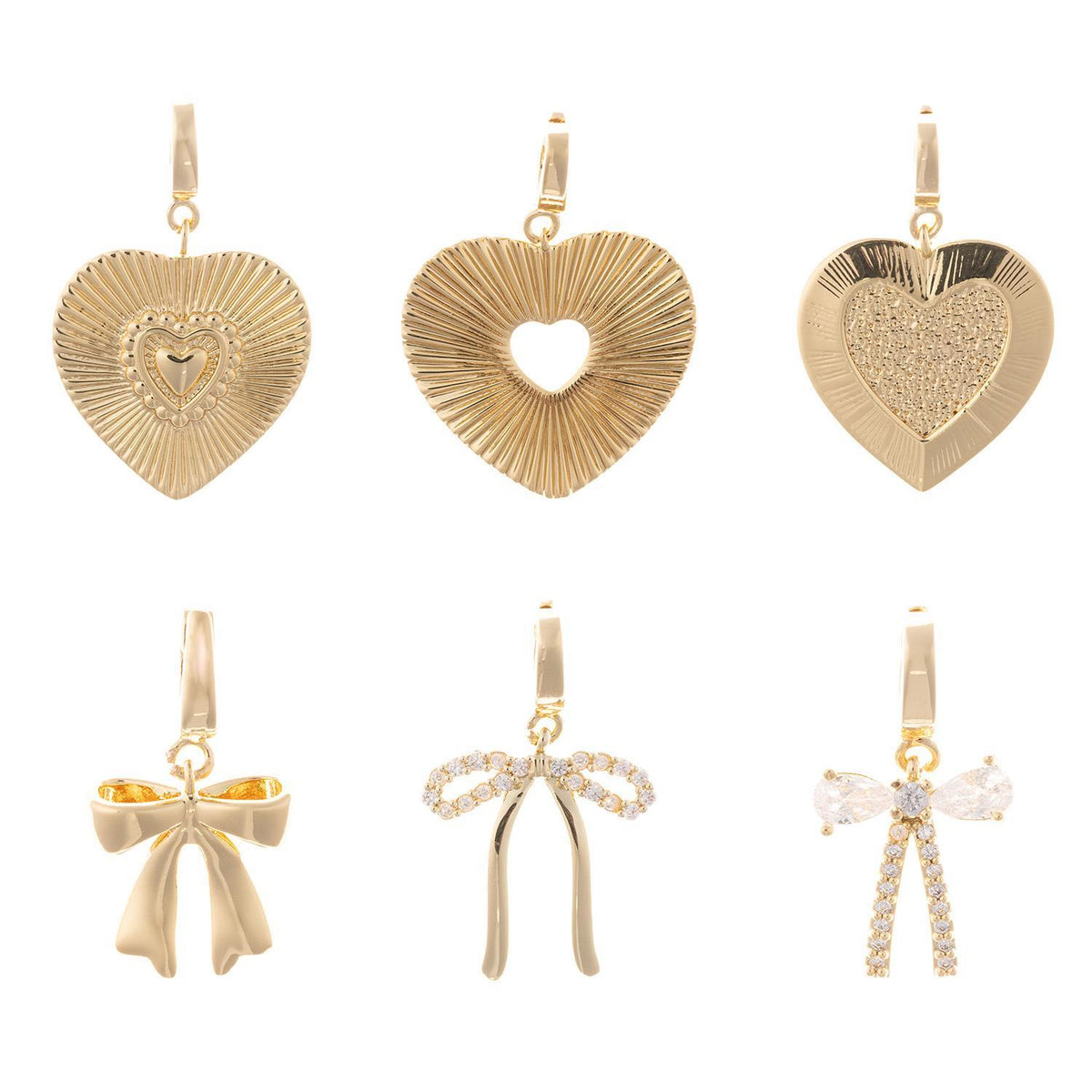 Gold-plated charm with a .5-inch length featuring an openwork heart silhouette and a clasp attachment.