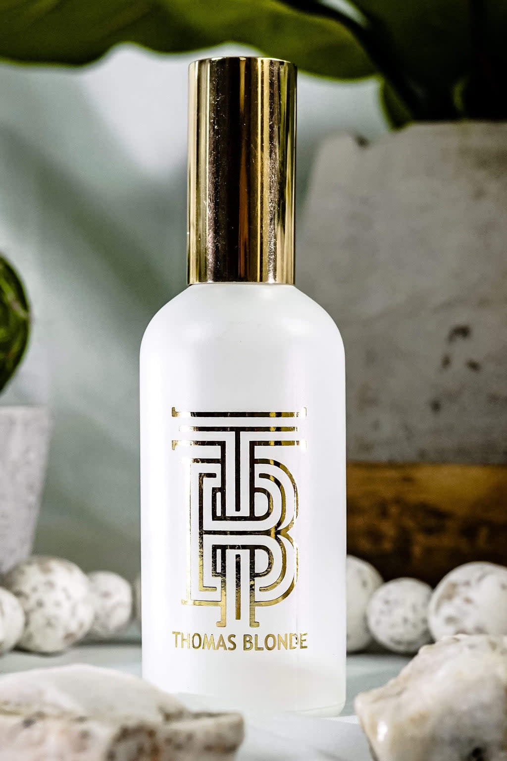 Bottle of Room Re-Fresh Linen Spray with a pump dispenser.