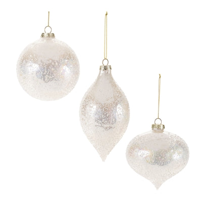 Three iridescent white glass ornaments in round, teardrop, and onion shapes with gold hangers.