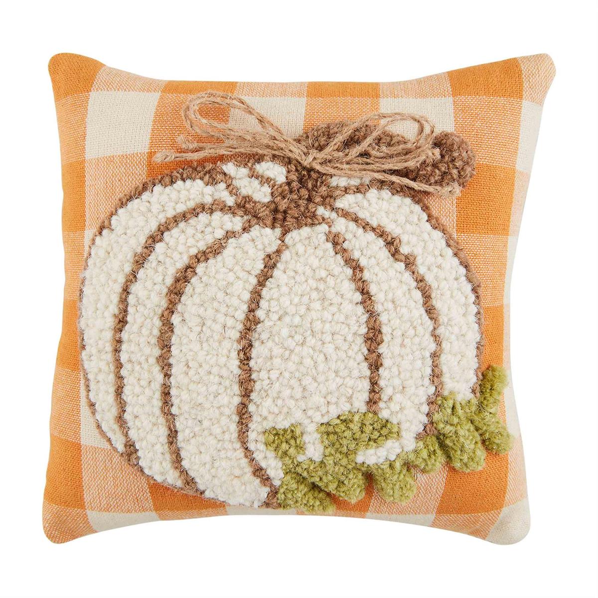 Two hook wool pillows with a pumpkin leaf print in earthy tones.