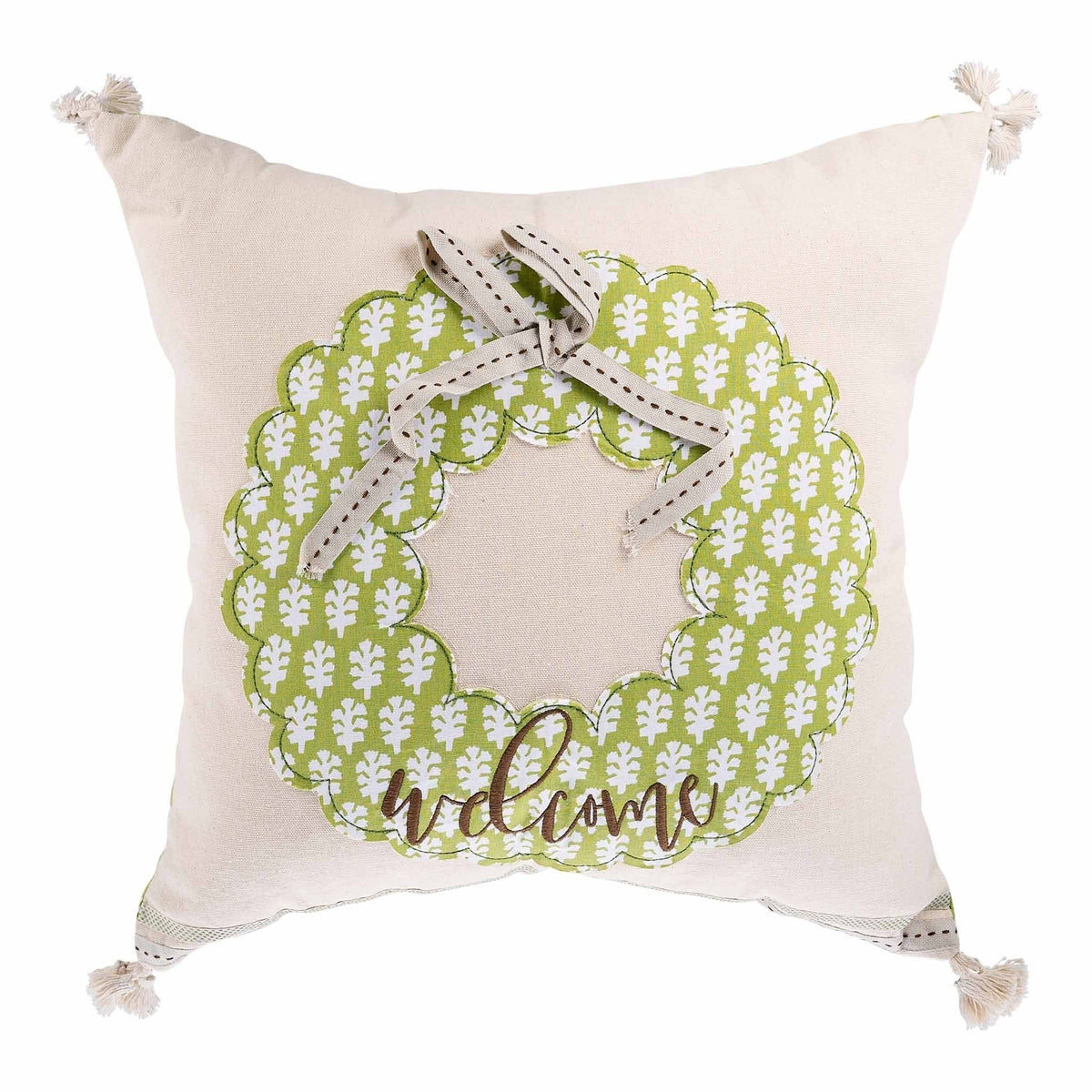 Square green pillow featuring a white wreath with leaves.