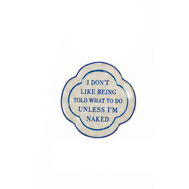 Hand-painted stoneware magnet with blue script saying: I don't like being told what to do unless I'm naked.