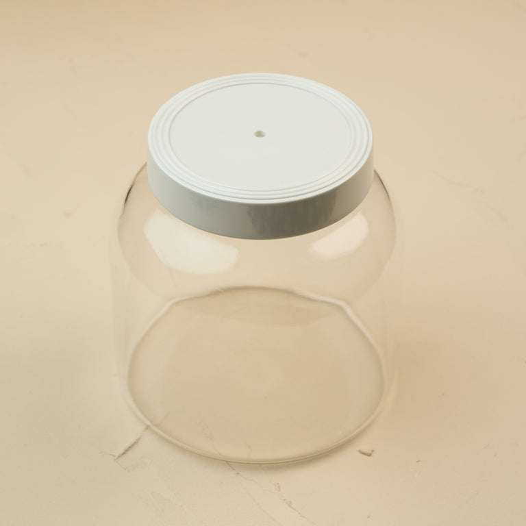 Clear glass Super Canister with a white melamine lid featuring a hole for Nora Fleming minis.