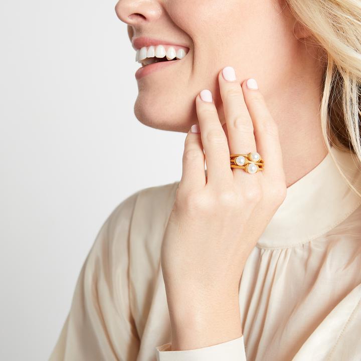 Three stacked Julie Vos rings in gold plate with pearl accents