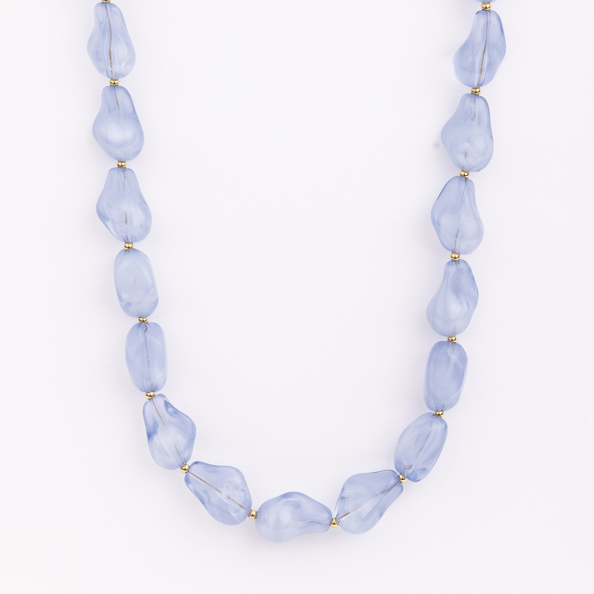 Cami Necklace featuring irregular light blue translucent beads separated by small gold spacers.