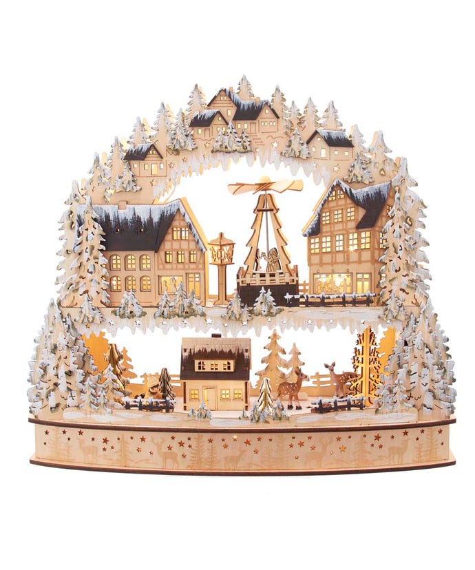 Split-level wooden winter village with star cutout base illuminated by warm white LEDs