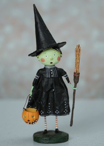 Ten-inch poly resin Wicked Witch figurine with a black hat and broomstick silhouette.