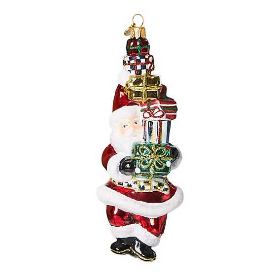Glass Christmas ornament shaped like Santa Claus in red with white beard and hat.