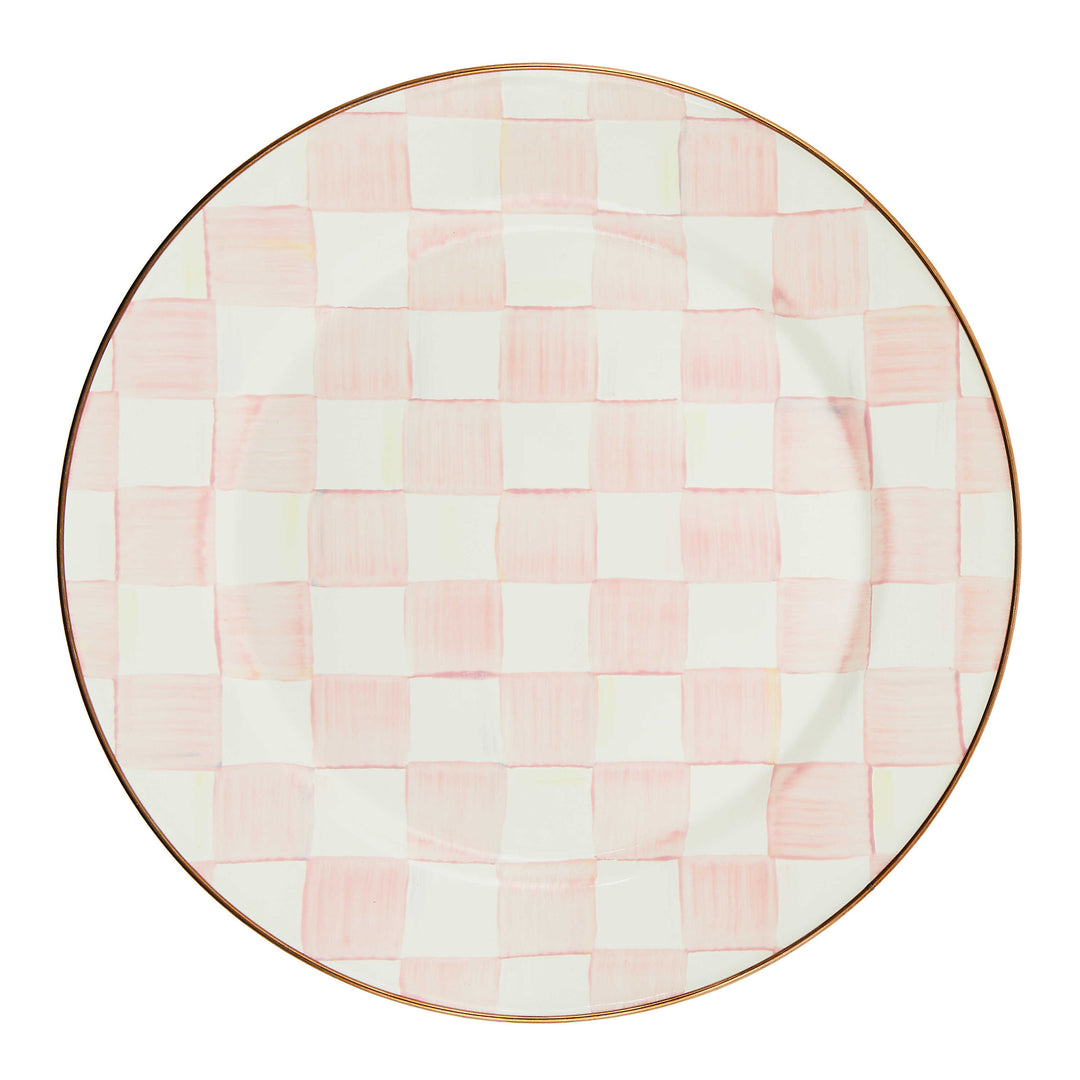 Round enamel plate with hand-painted pink and white checks and a bronzed stainless steel rim.