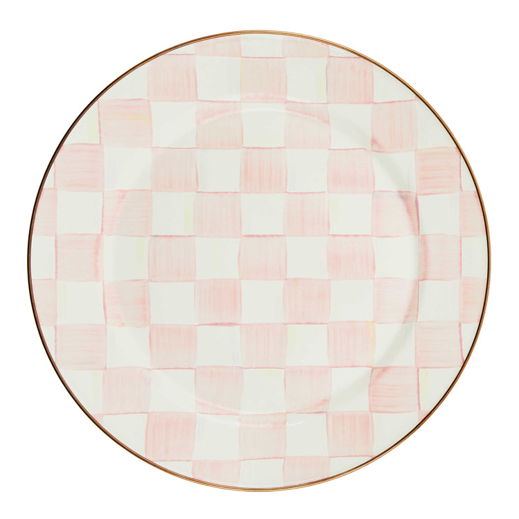 Round enamel plate with hand-painted pink and white checks and a bronzed stainless steel rim.