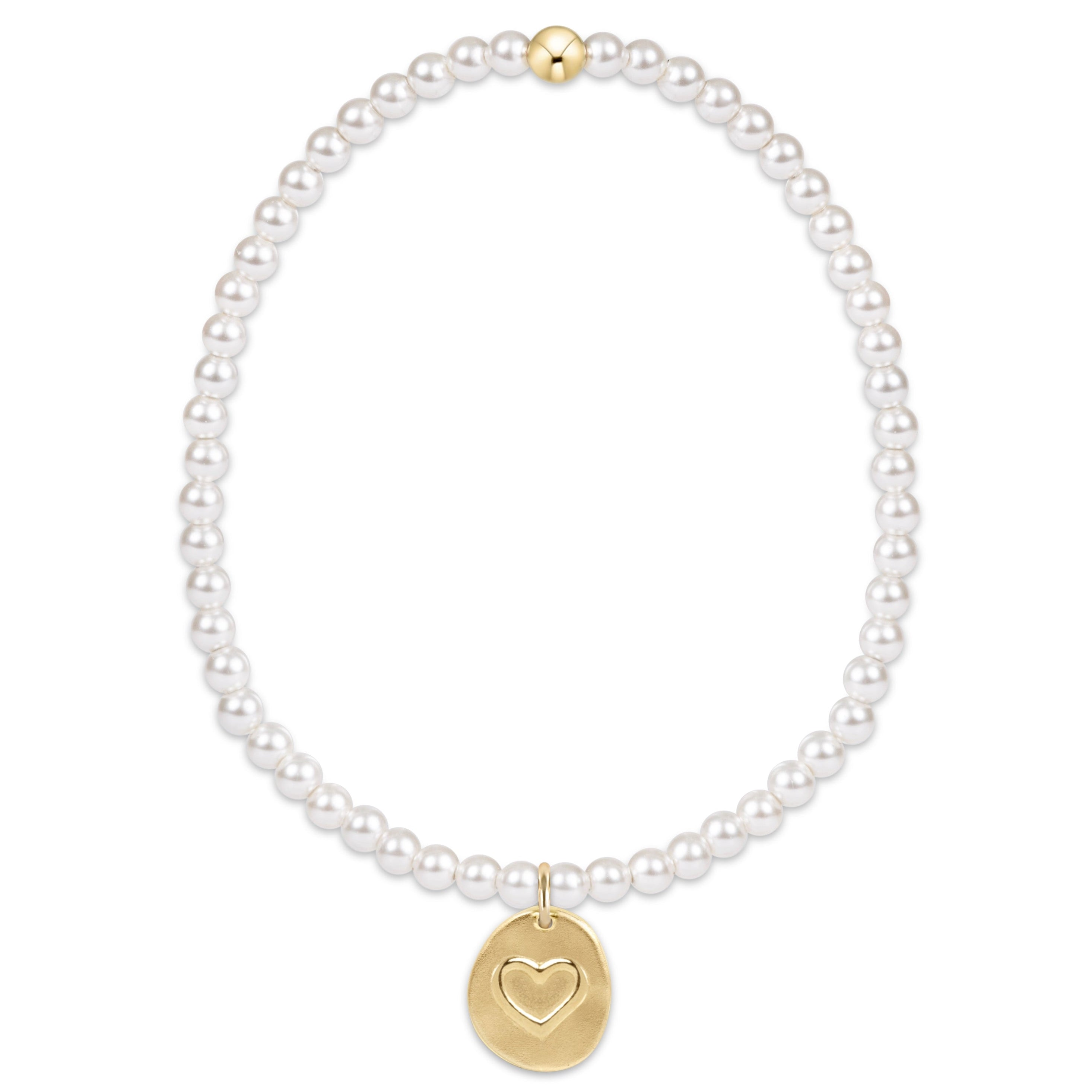 Classic 3mm pearl bracelet with a small gold disc charm featuring an engraved heart.