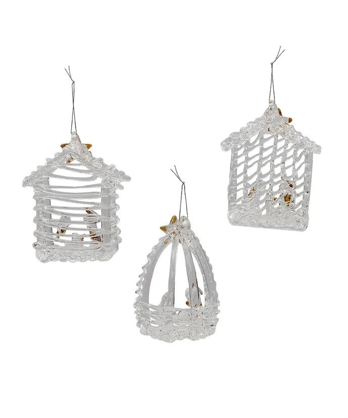 Set of three spun glass nativity ornaments featuring the Holy Family with gold star accents.