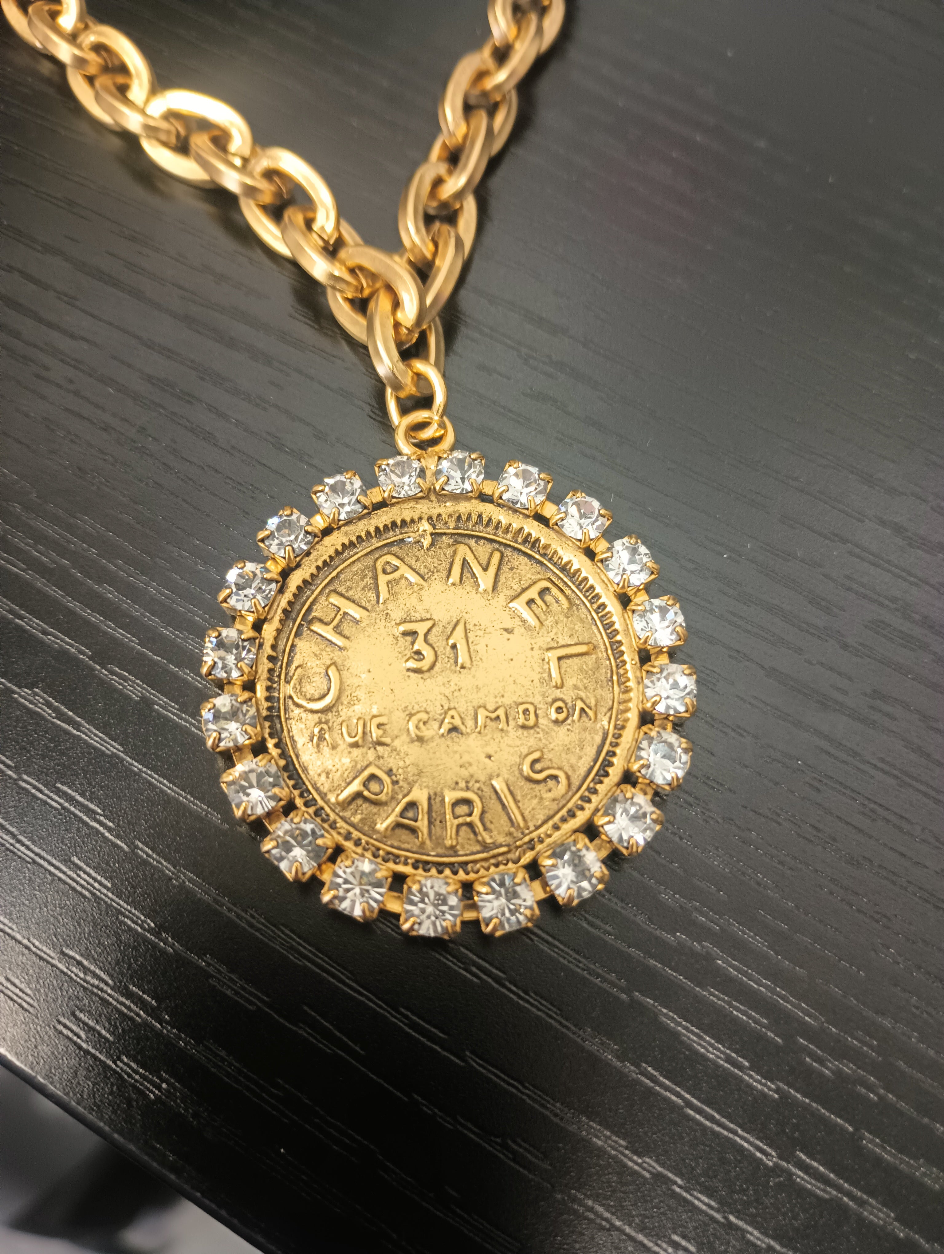 8 3/4 inch gold plated necklace with Chanel-style coin pendant featuring rhinestones