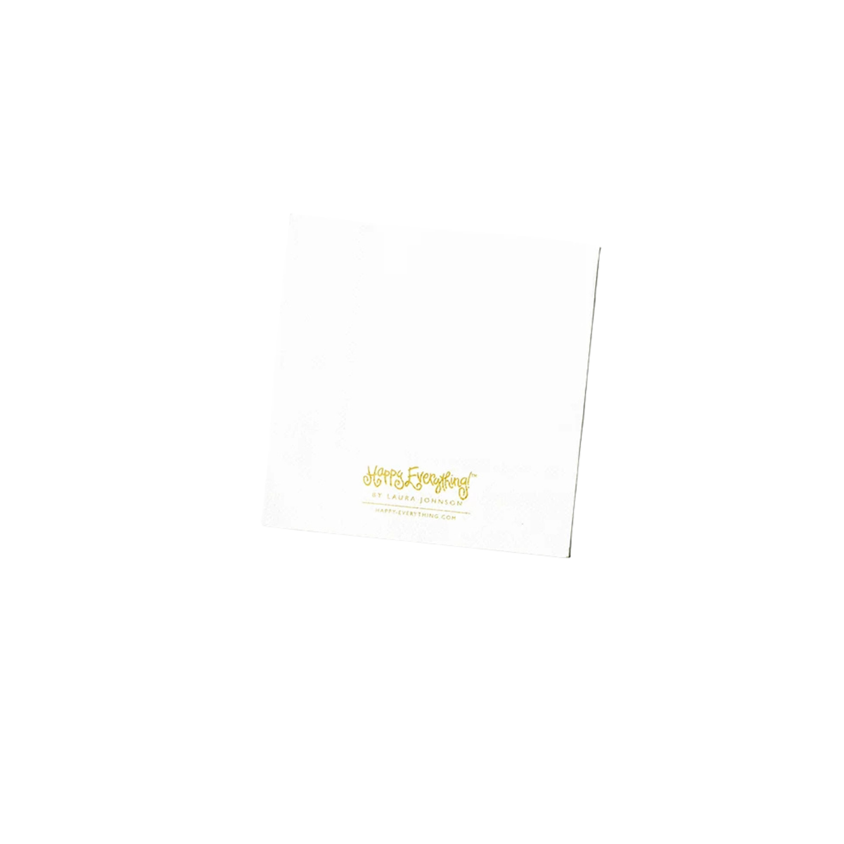 White cocktail napkin with gold Happy Everything! logo by Laura Johnson.