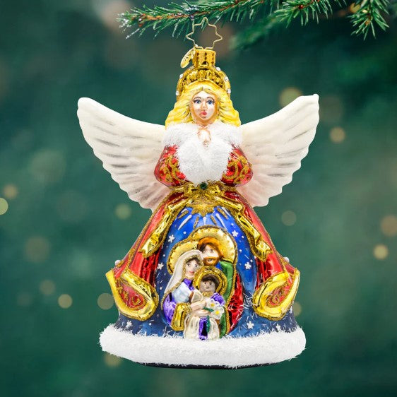 Nativity Guardian angel ornament with white wings and a nativity scene painted on her blue gown.