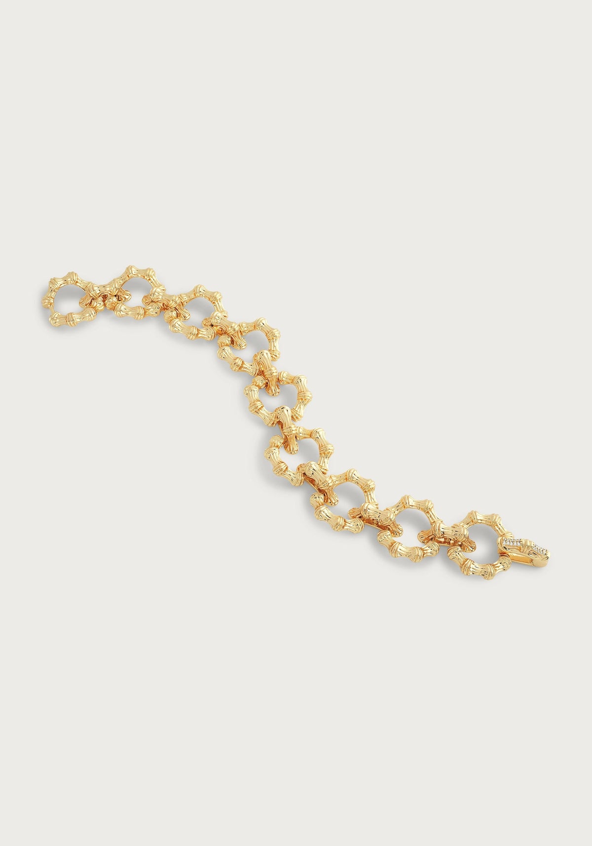 18K gold-plated Bamboo Chain Bracelet with textured links and a crystal pavé closure.