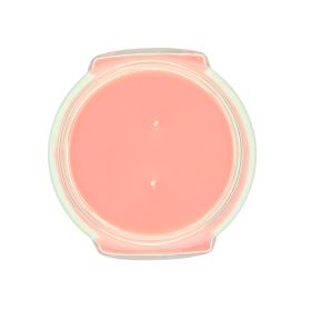 Top view of a pink 11oz Tyler candle in a glass jar with two wicks.