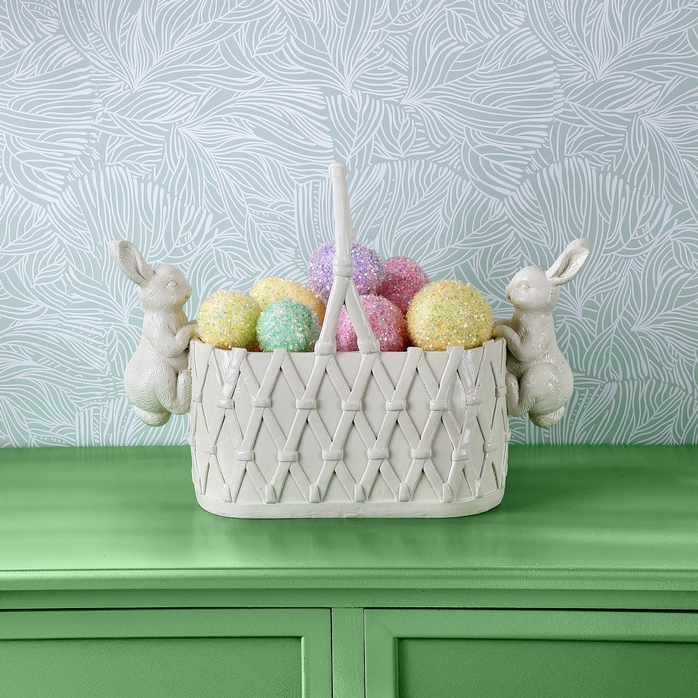 Resin planter shaped like a woven basket with bunny figures holding its sides.