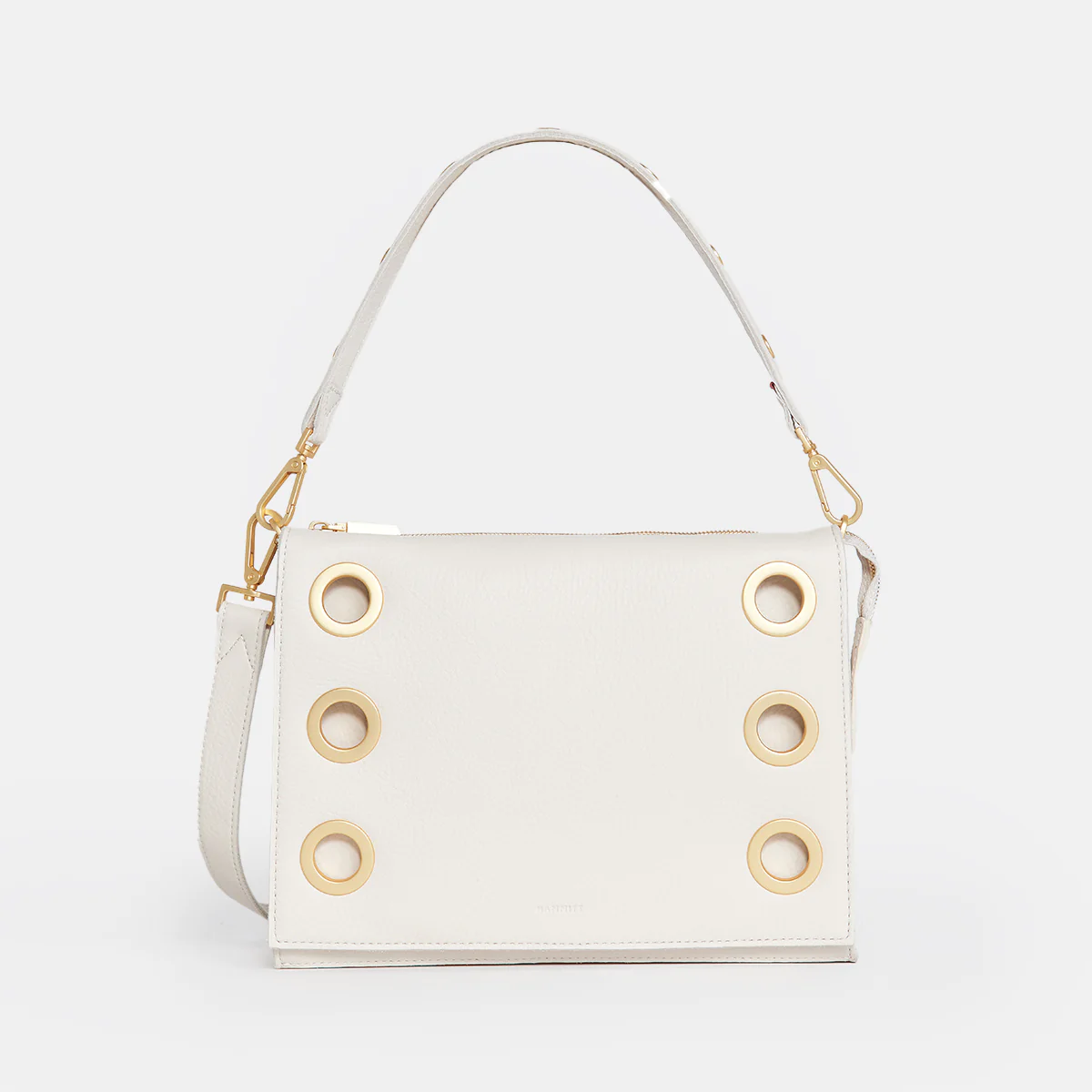 Large Montana Revival clutch in tan leather with vintage Hammitt strap, red base reveal, and riveted hardware.