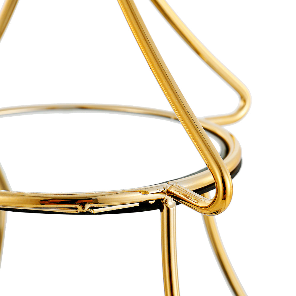 Gold tiered tree-shaped accessory stand with three levels holding items