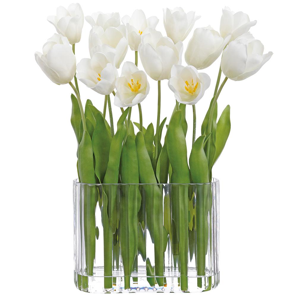 White tulip arrangement in a glass vase with polyester flowers.