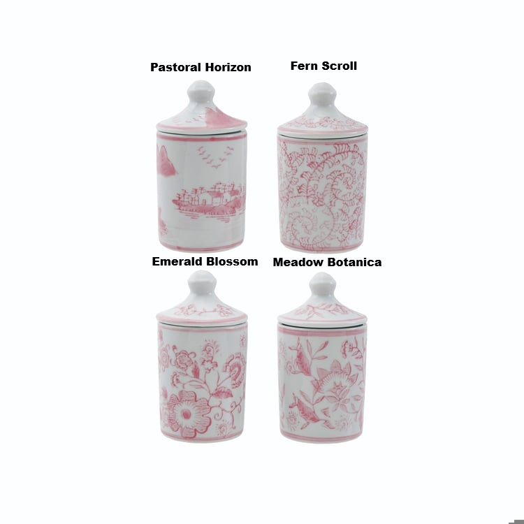 Four hand-stamped pink stoneware spice jars with lids in various floral and landscape patterns.