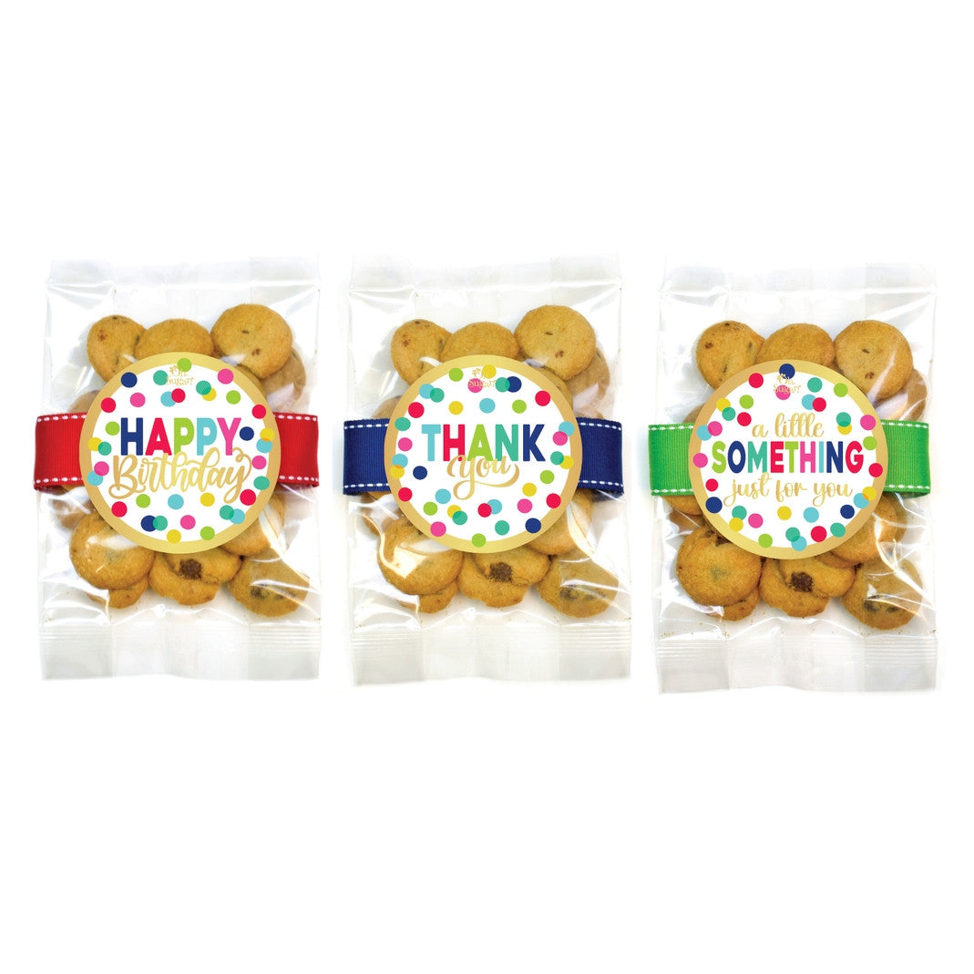 Small dot-patterned cookie bag holding three cookies